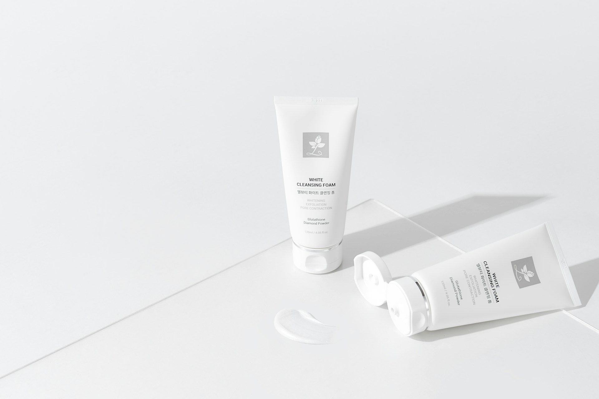 a tube of cream next to a tube of cream