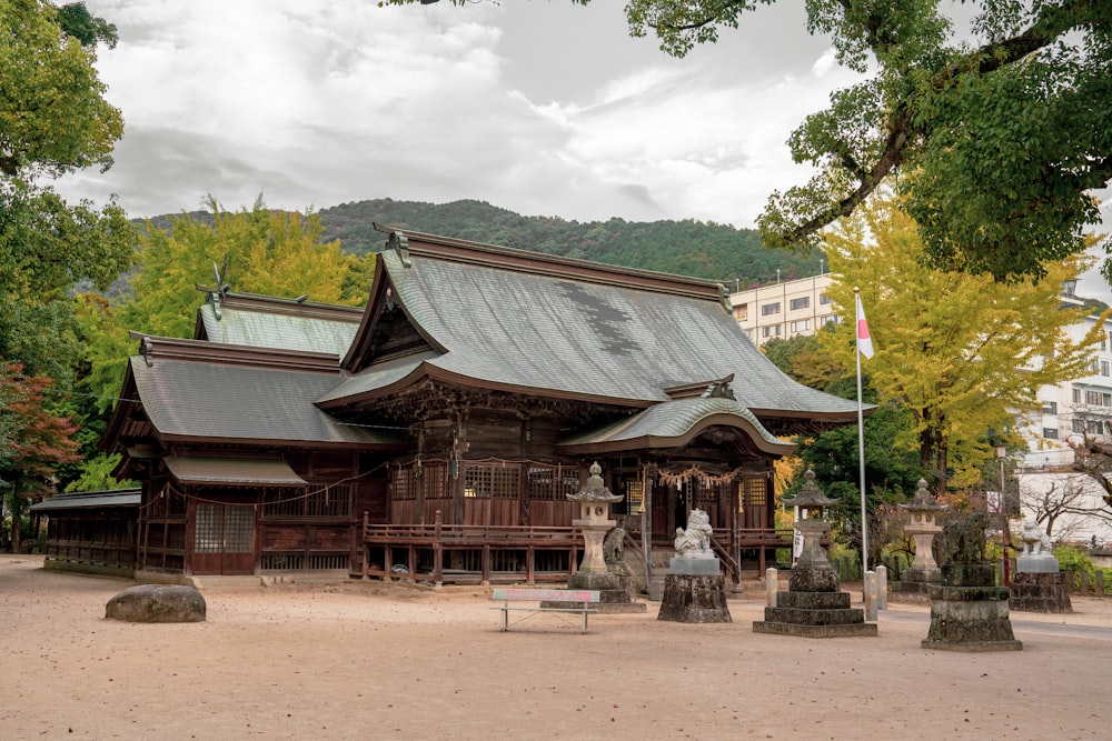 a large wooden building sitting in the middle of a park