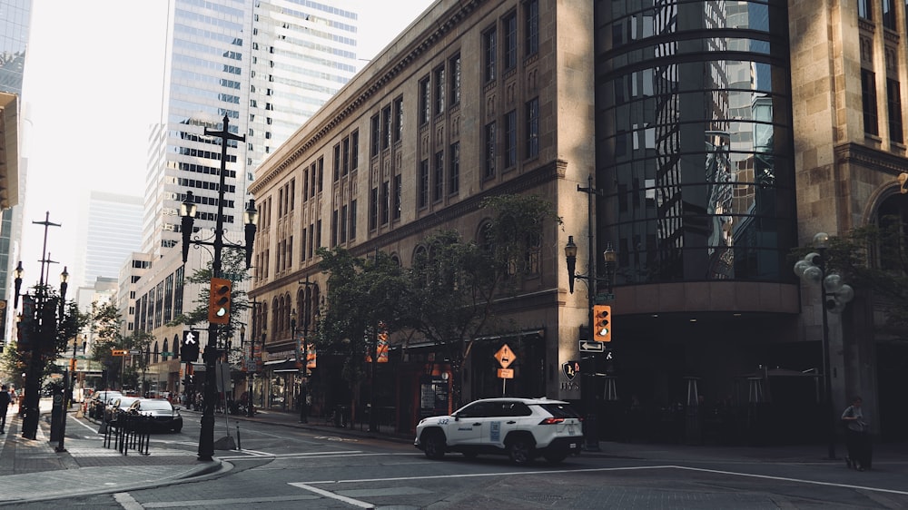 a car is driving down a city street