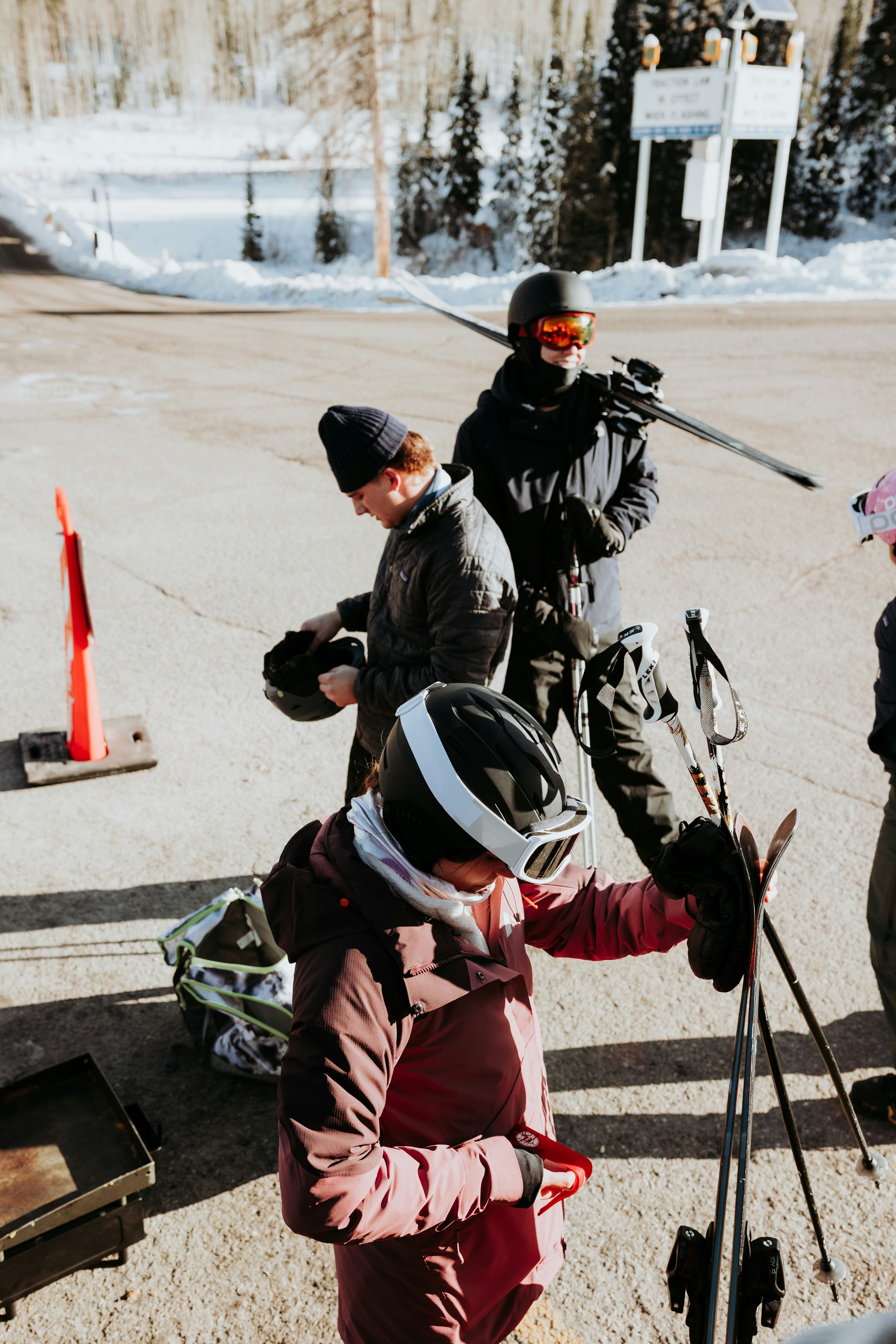 a group of people standing around each other on skis