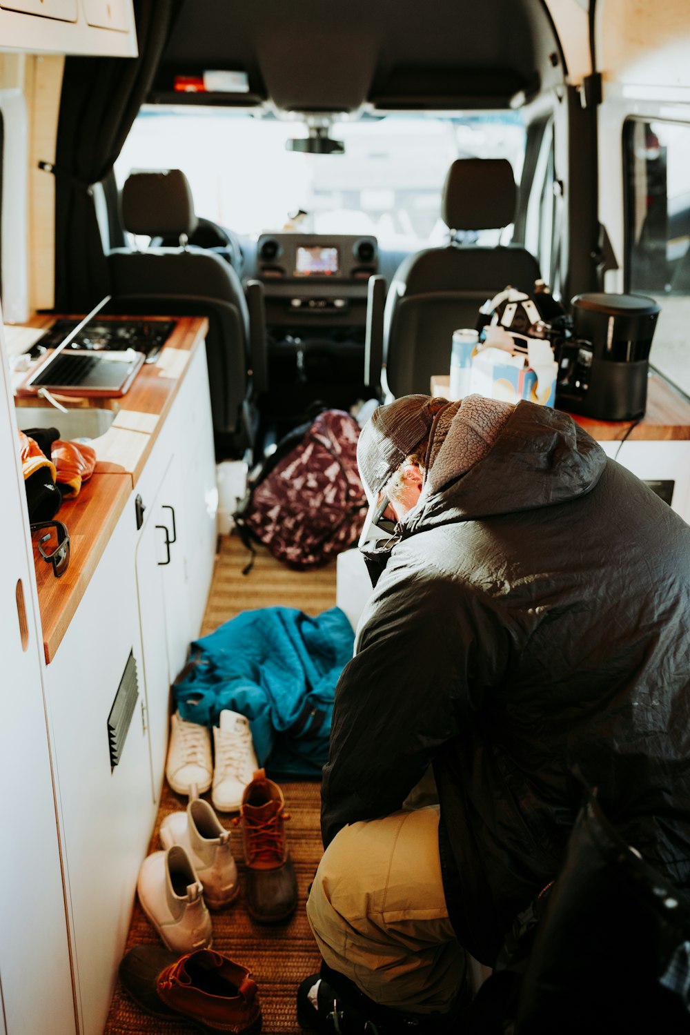 a man sitting in the back of a van