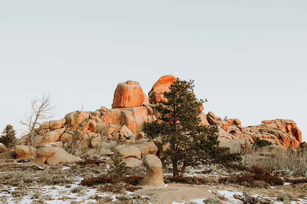 a large rock formation in the middle of a desert