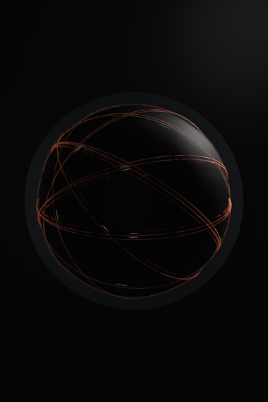 a black and orange ball with lines on it