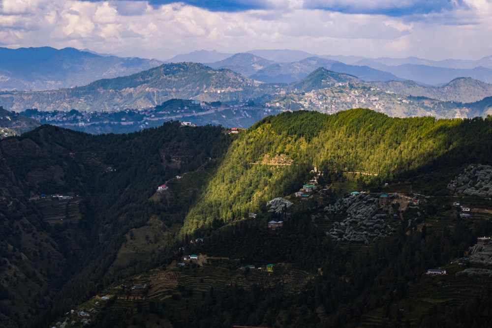 a view of a valley with mountains in the background