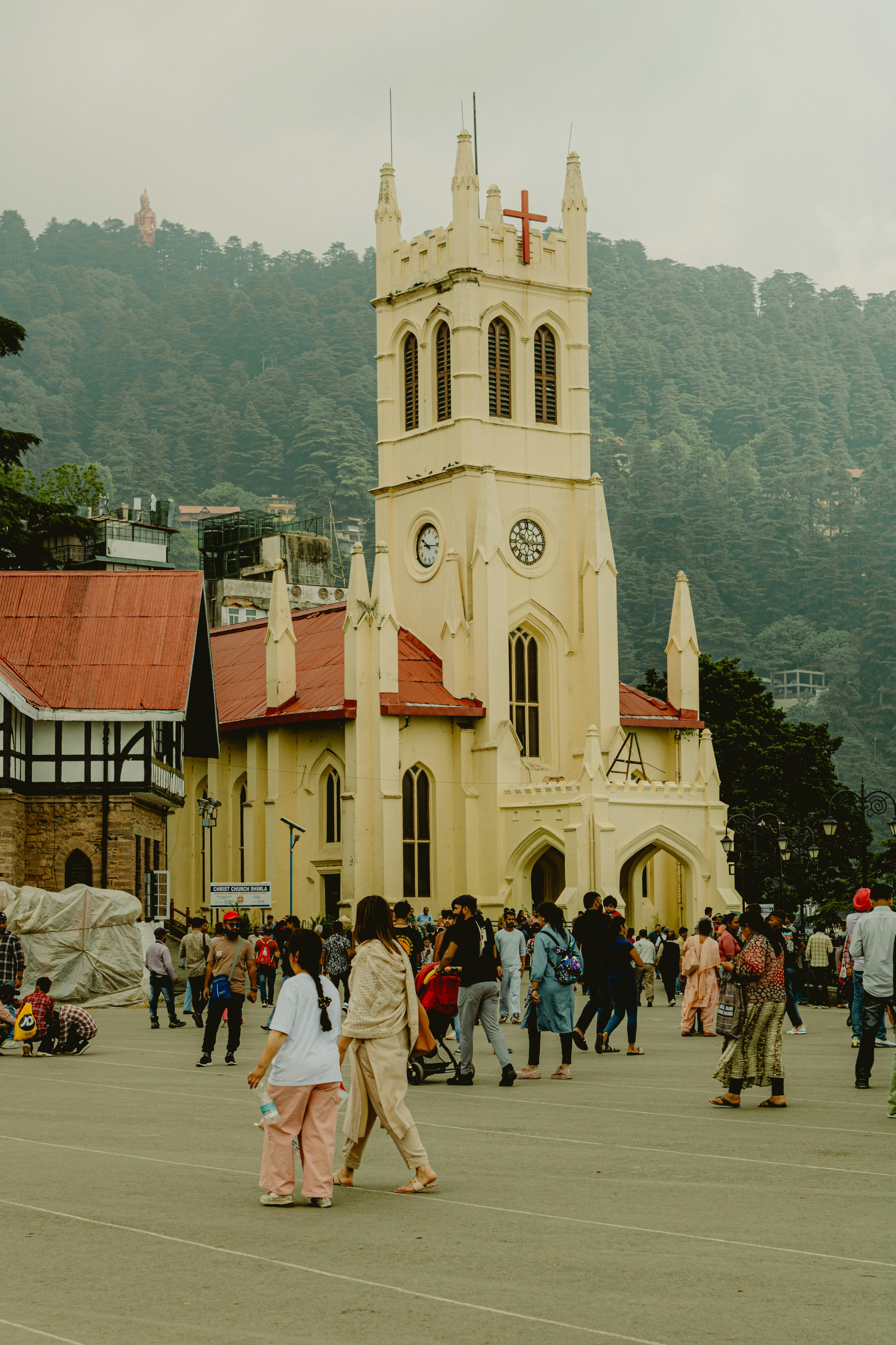 a group of people walking in front of a church
