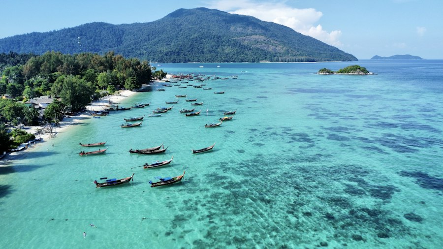 Boats floating in clear water on a Krabi island tour