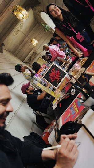 A vibrant community gathering showcasing people engaged in educational activities and social discussions.