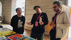 A group of students discussing college options with a counselor, surrounded by colorful educational posters