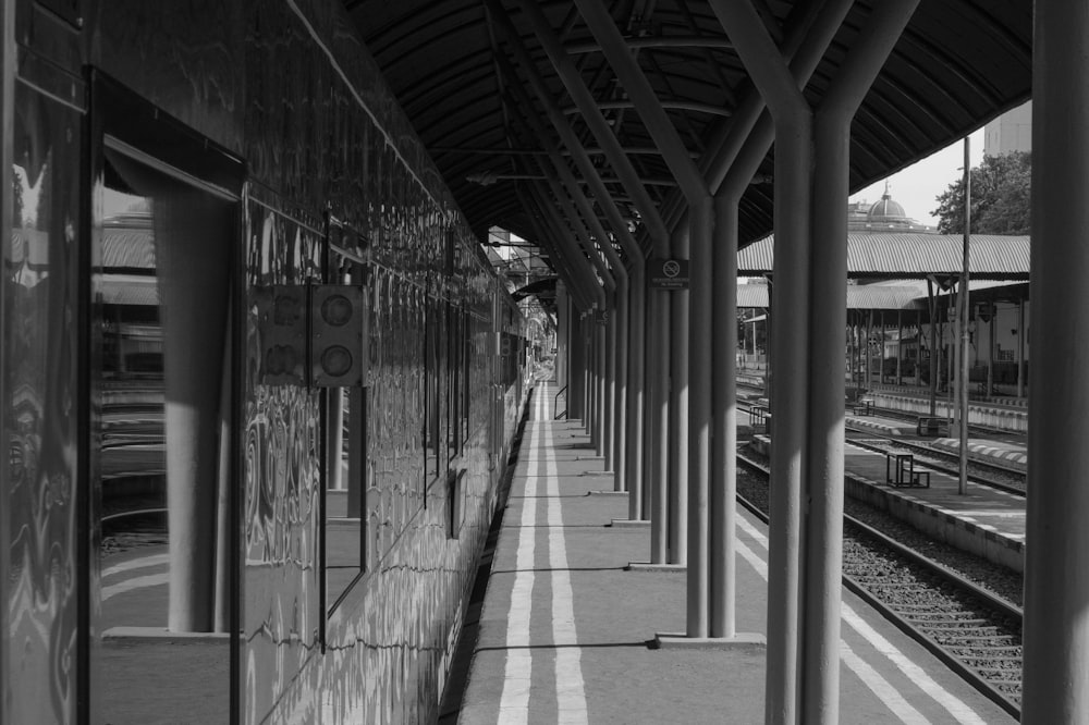 a black and white photo of a train station