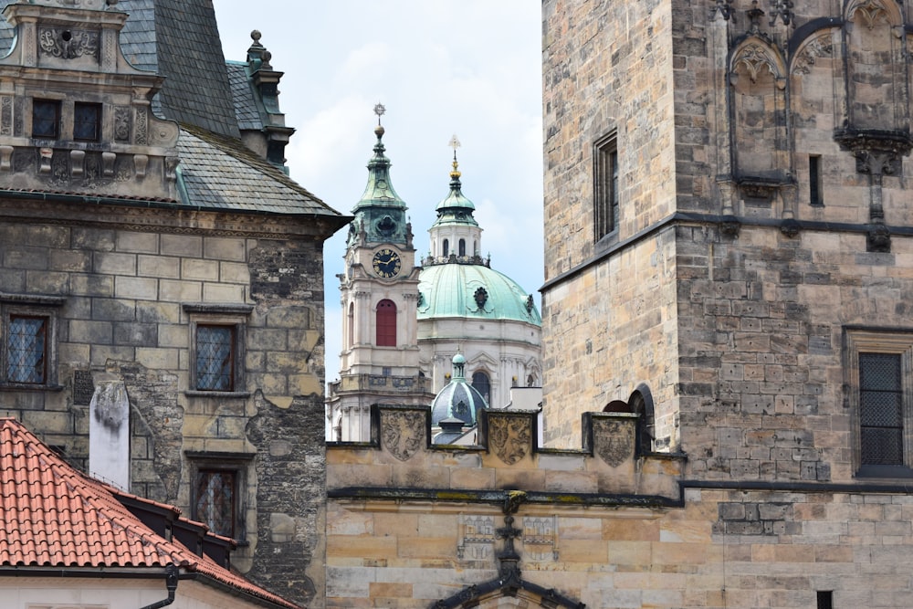 a view of a building with a clock tower in the background