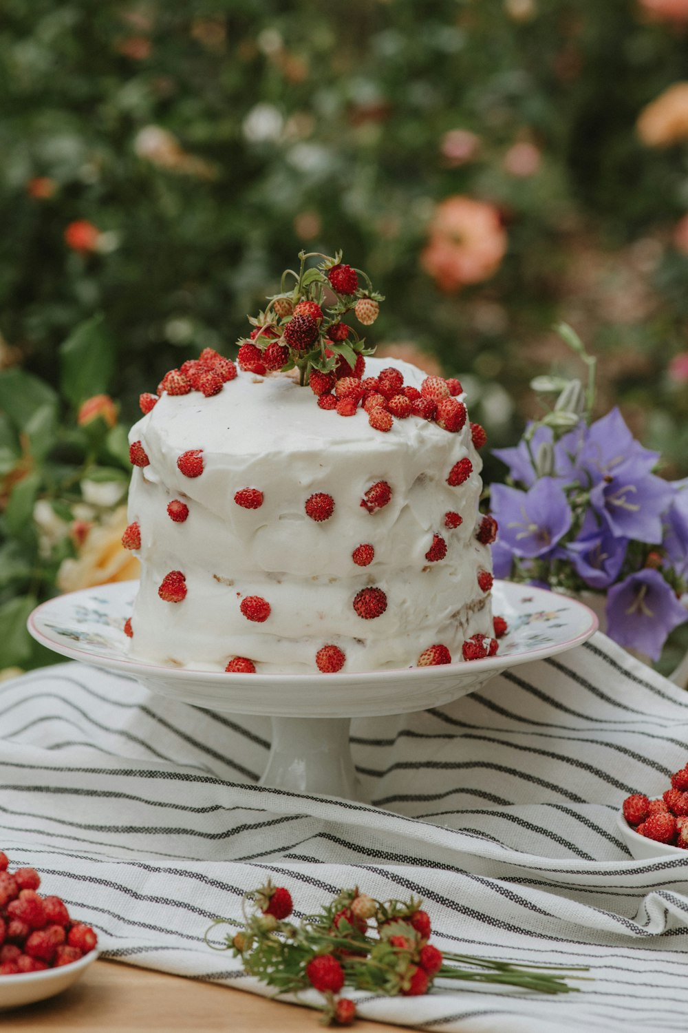 a white cake with strawberries on top of it