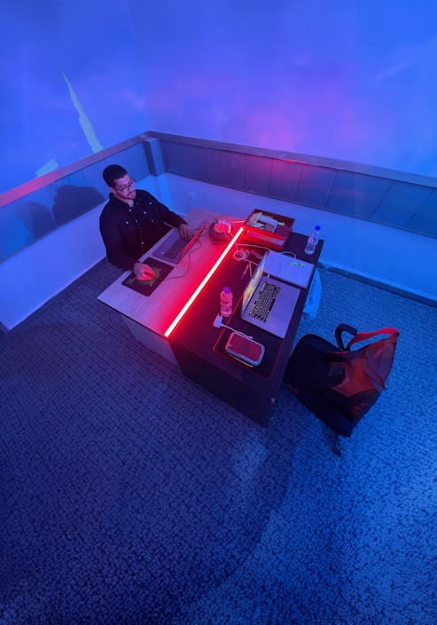 A business professional using a laptop in a modern office environment, emphasizing productivity and efficiency.