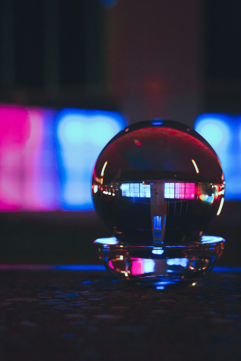 a glass ball sitting on top of a table