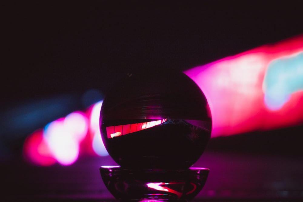 a glass ball sitting on top of a table