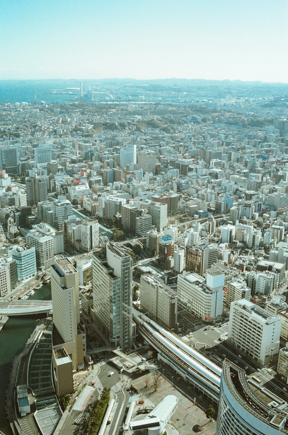 an aerial view of a city with tall buildings