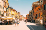 A vibrant street scene in Rome with colorful buildings and lively cafes