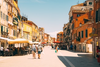 A vibrant street scene in Europe with colorful buildings and lively cafes.