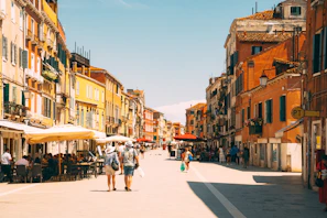 A vibrant street scene in Rome with colorful buildings and lively cafes