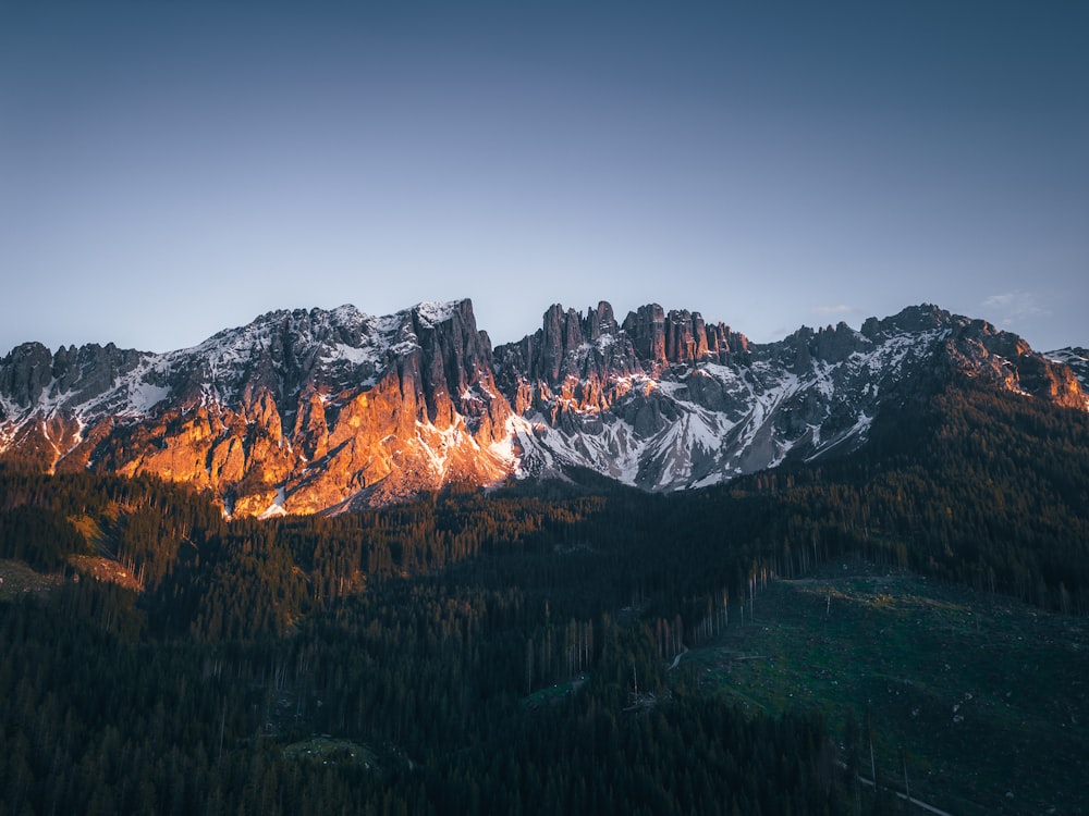 a view of a mountain range at sunset