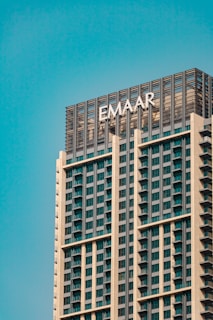 a tall building with the word emaar written on it