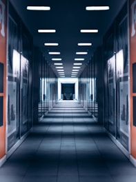 a long hallway with a bunch of lights on the ceiling