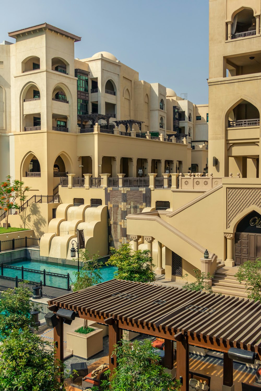 a large building with a pool in front of it