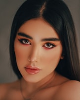 A striking portrait in oil featuring expressive eyes and textured skin details.