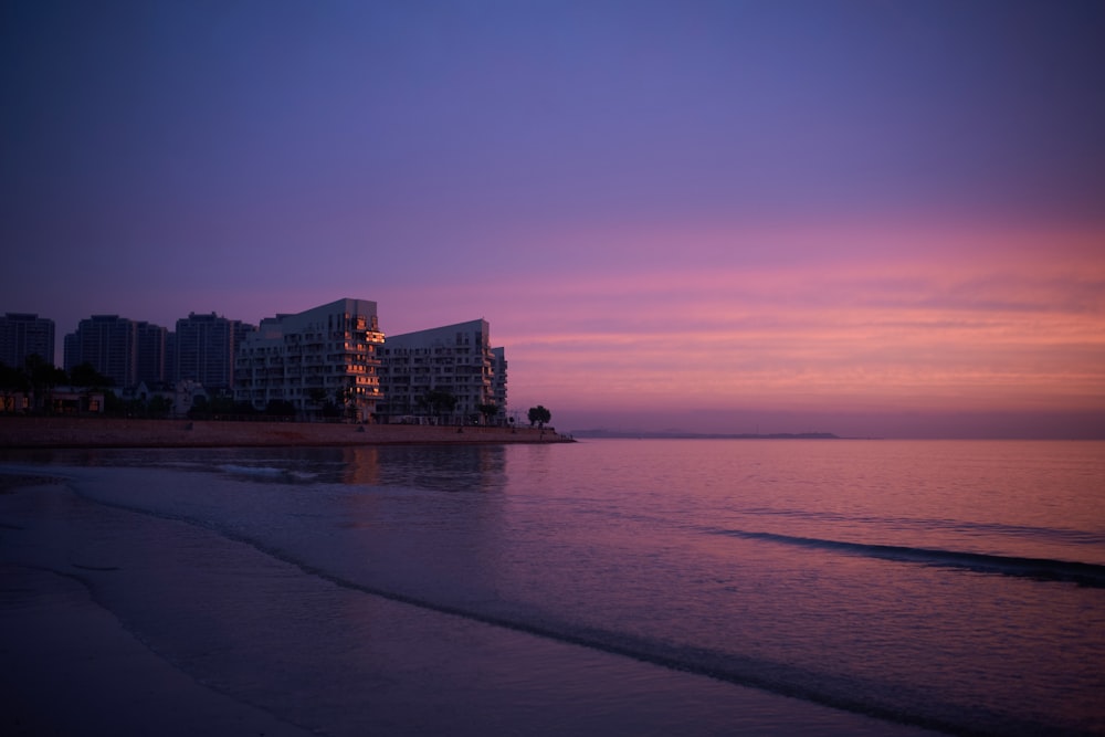 a beach with a building in the distance