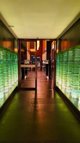 Sophisticated boardroom bathed in shadow with subtle neon green accents.
