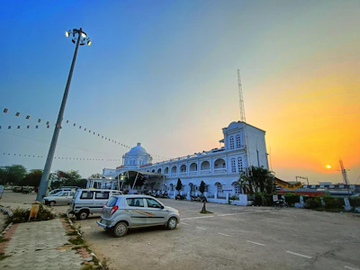 A colorful colonial building in the heart of Porto-Novo at sunset.