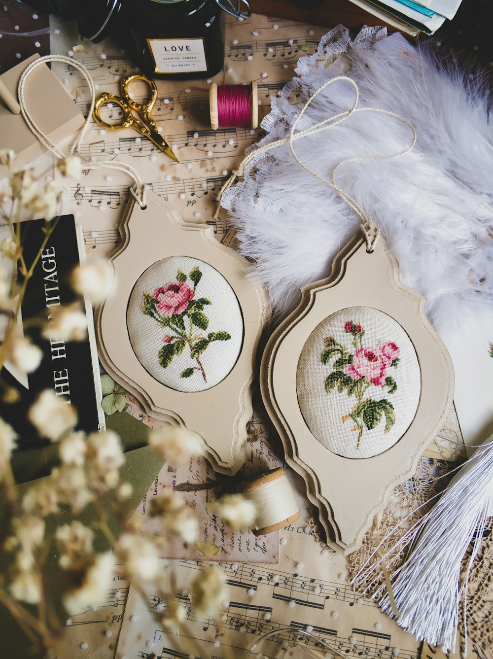 a table topped with a couple of plates covered in flowers