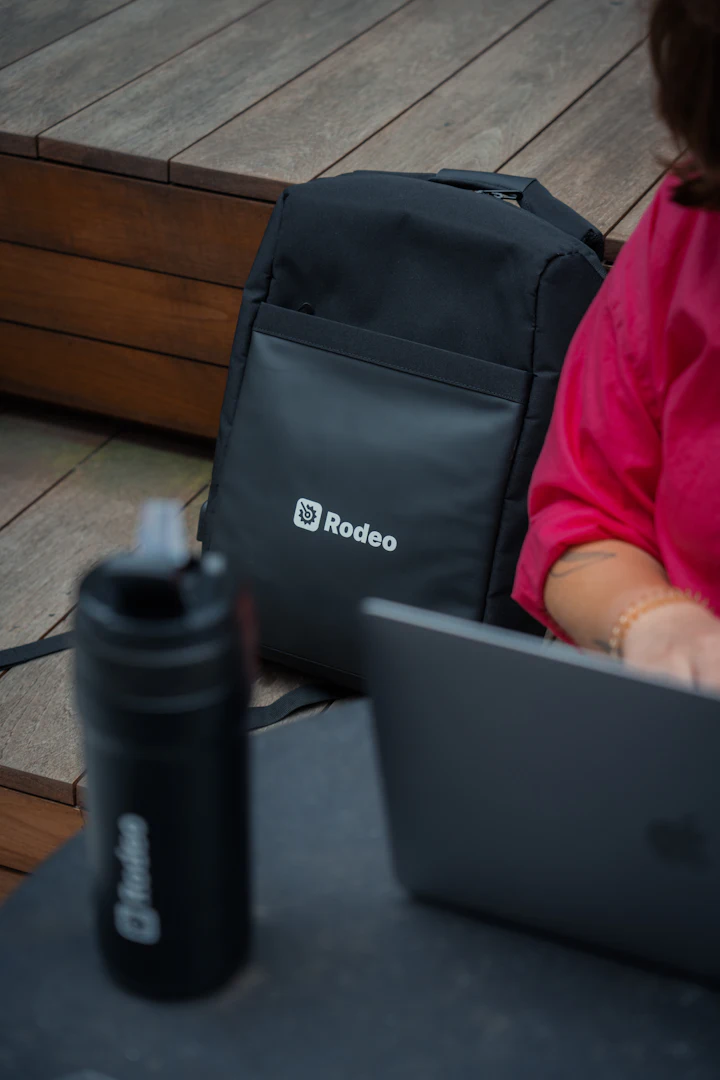 Woman sitting at a table working on a laptop