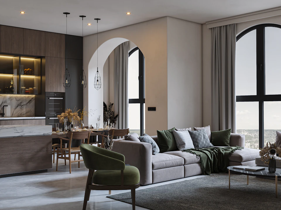 Gray sofa with green throw pillows in modern living room with large window view outside