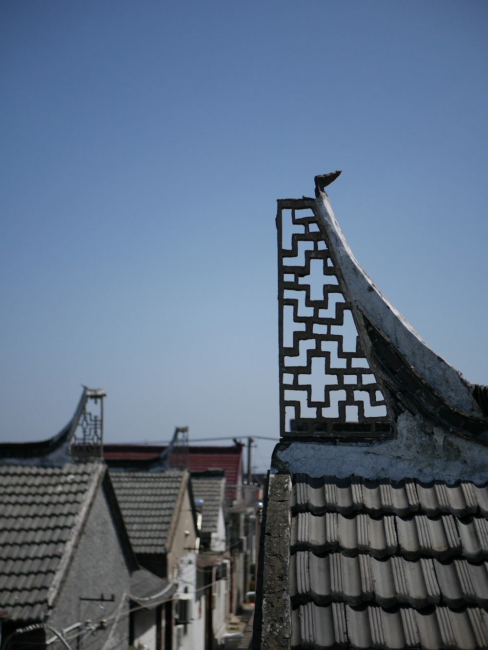 the roof of a building with a bird perched on top of it