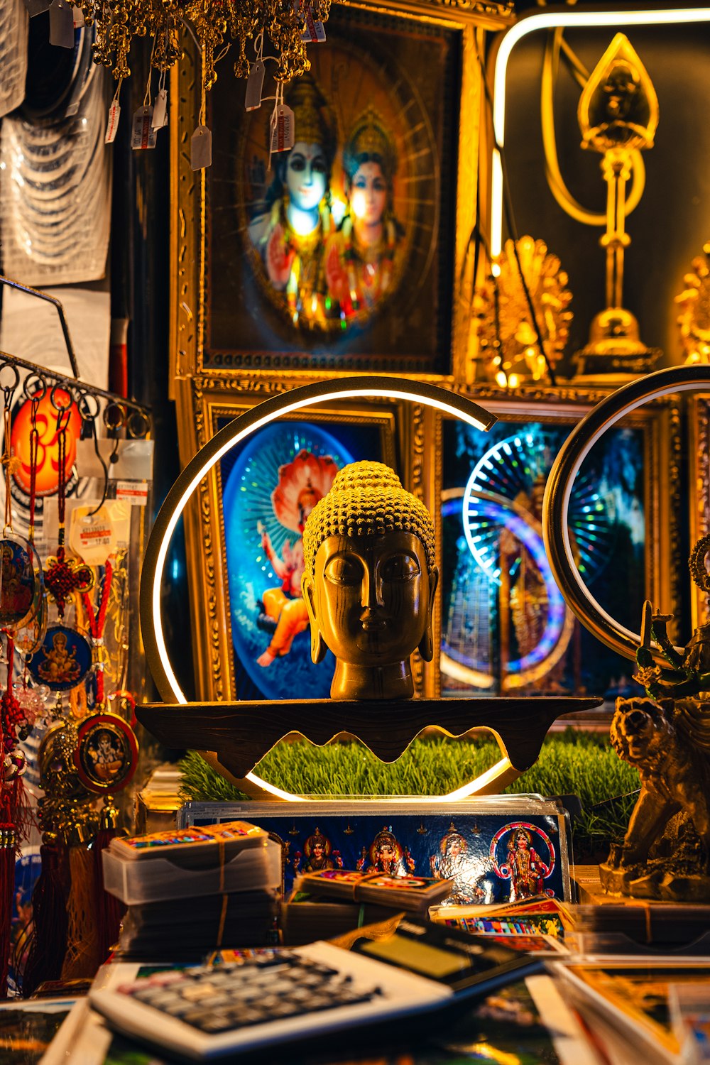 a buddha statue sitting in front of a mirror