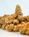 Close-up of beautifully packaged THC flower buds with delicate floral accents.