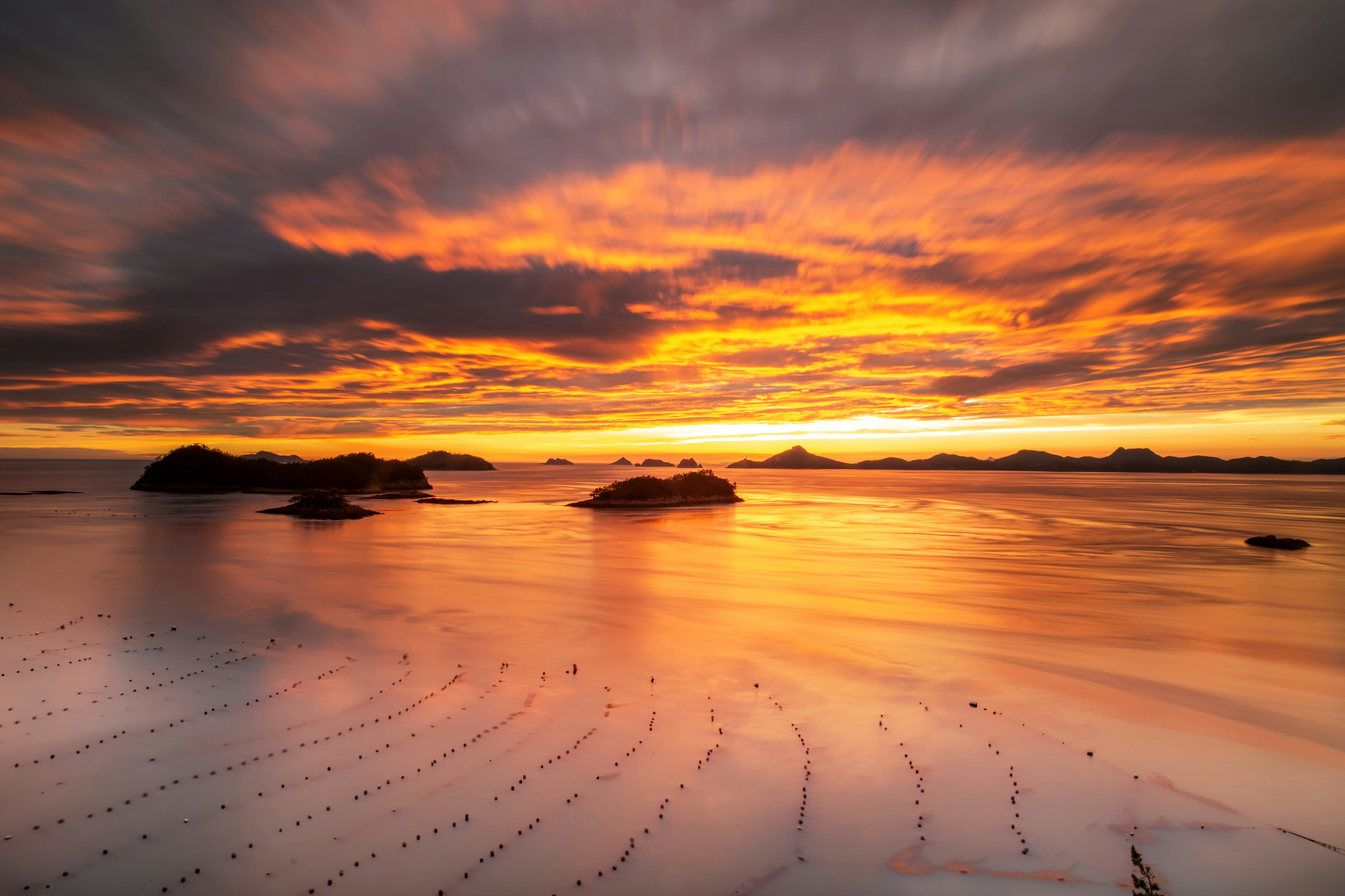 a sunset over jindo island in south korea