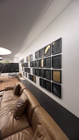A sleek, modern living room with bold African artwork integrated into a sophisticated interior design.