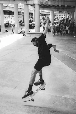 Group shot of diverse skaters mid-trick at an urban skatepark, embodying raw energy.
