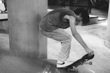 An instructor demonstrating skateboarding techniques to attentive students.