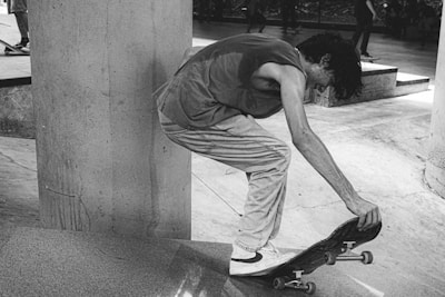 An instructor demonstrating skateboarding techniques to attentive students.