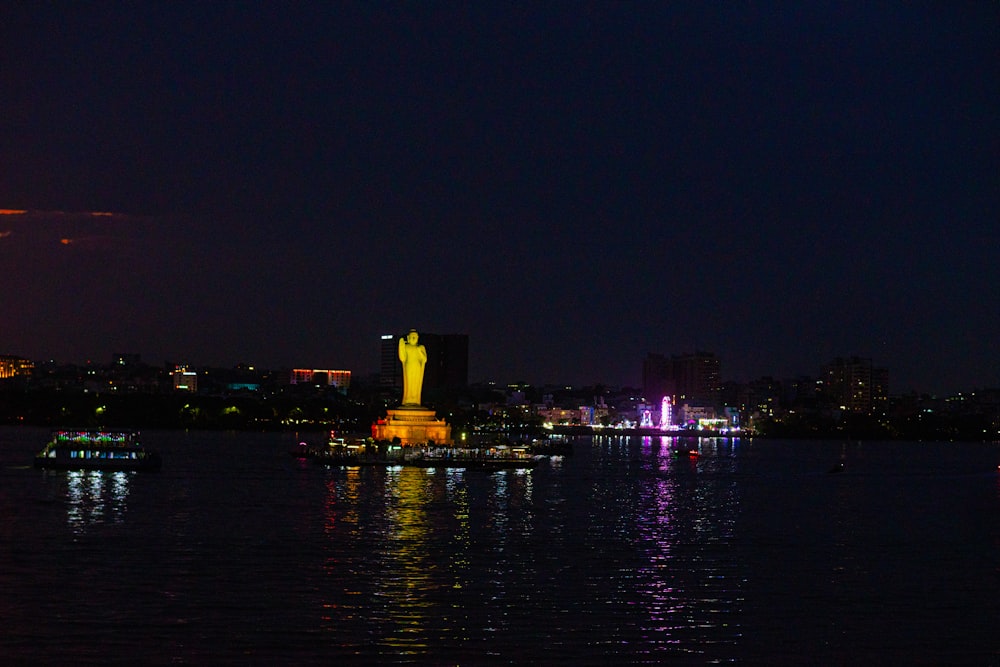 a large body of water with a city in the background