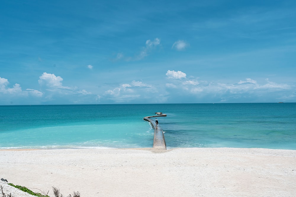 a view of a beach with clear blue water