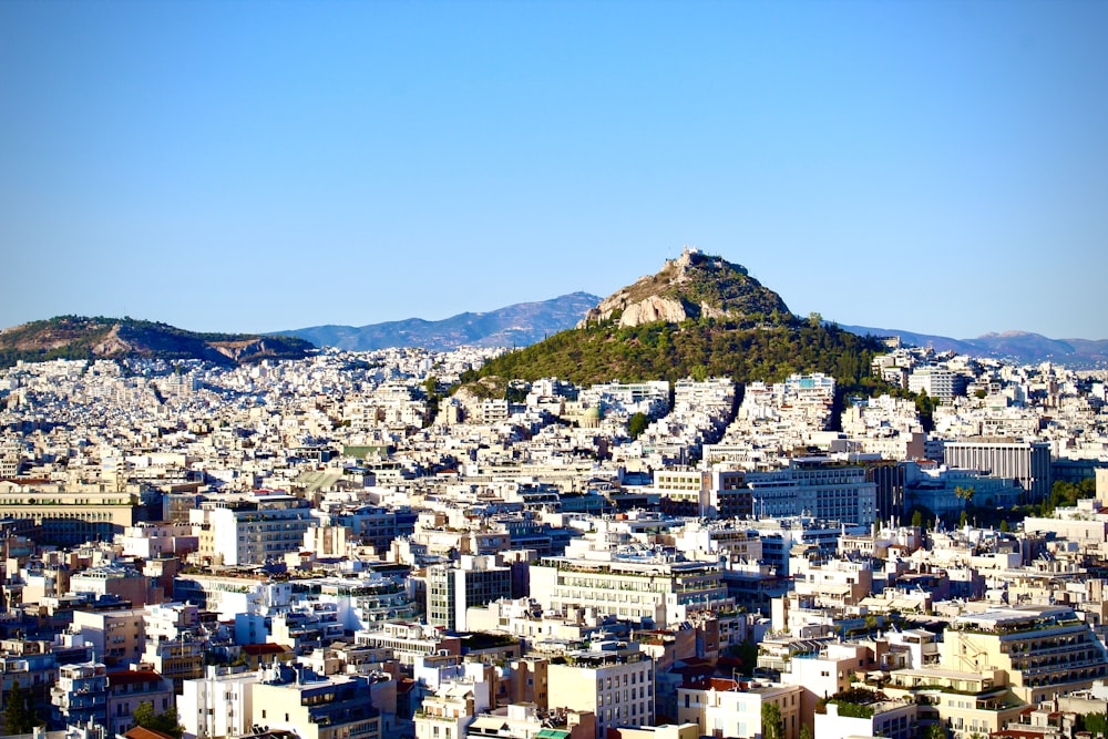 a view of a city with a mountain in the background