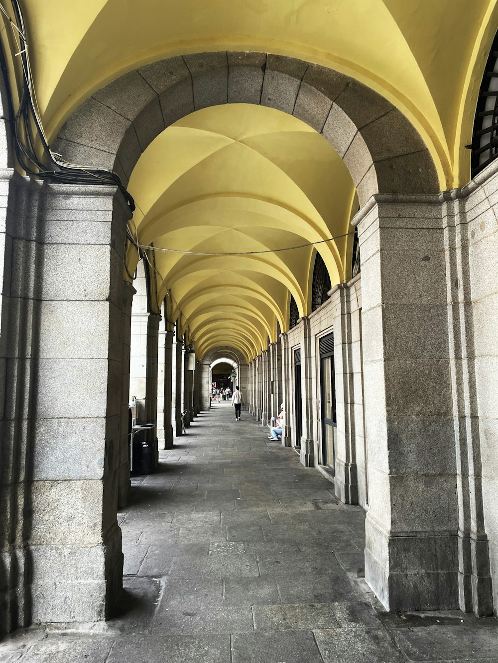 a row of arches on the side of a building