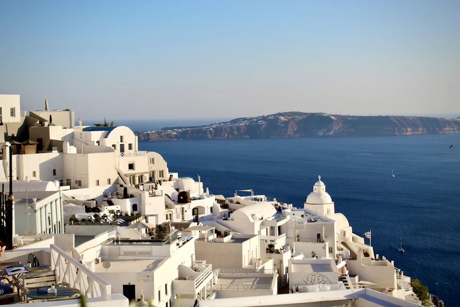 Whitewashed clifftop buildings overlooking the sea in Santorini, Greece