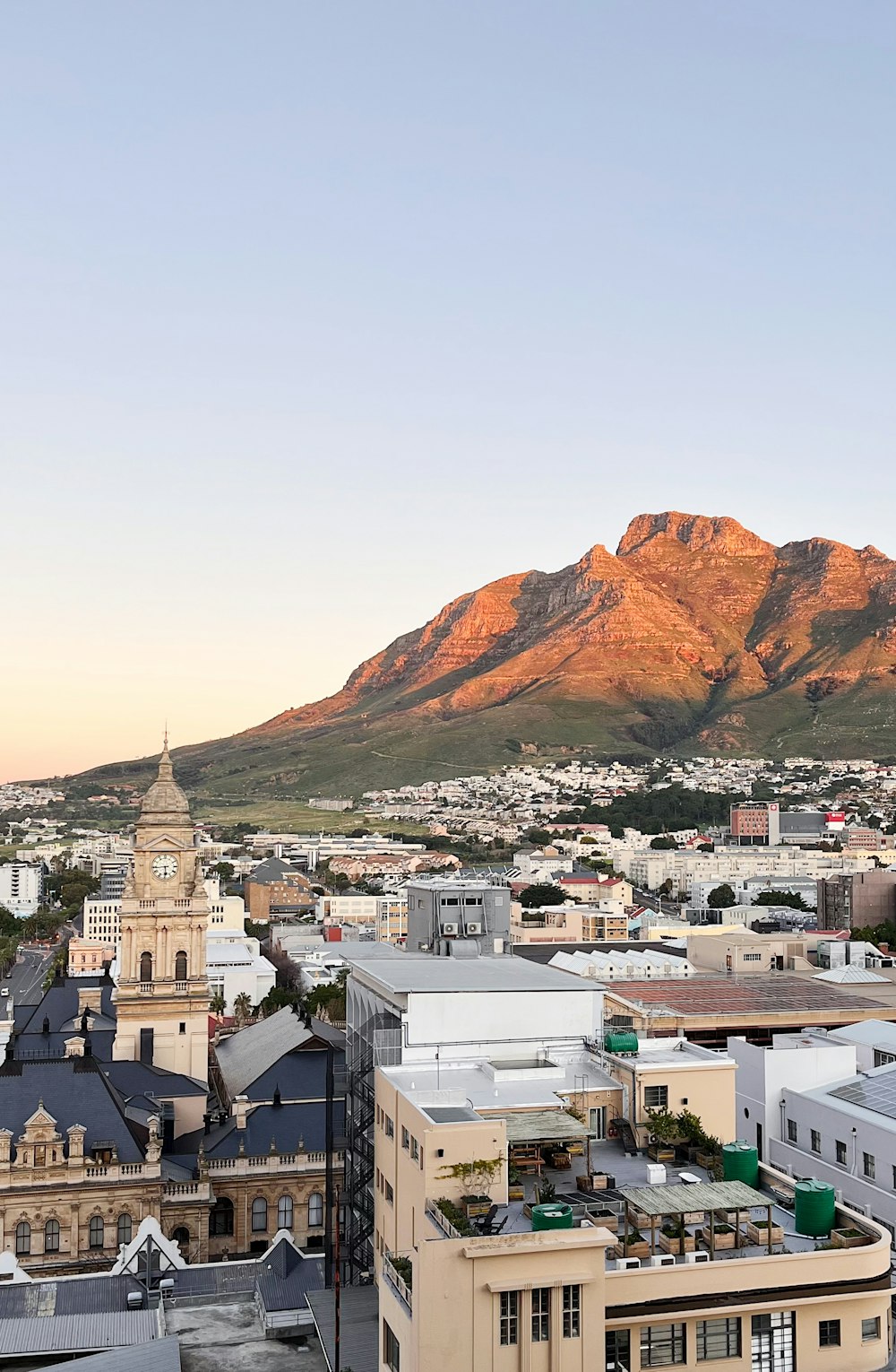 a view of a city with mountains in the background