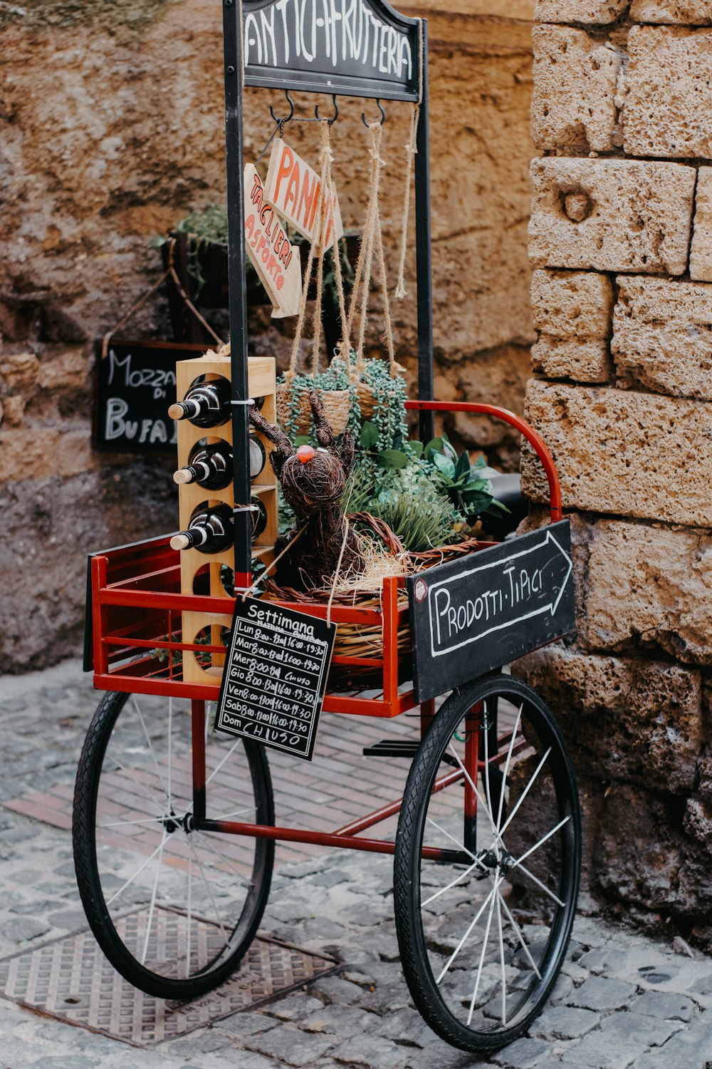 a red wagon filled with lots of plants