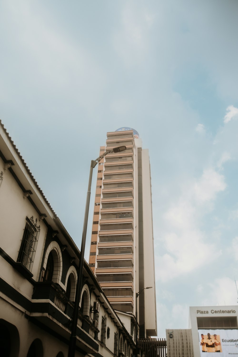 a tall building sitting next to a tall building
