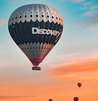 a group of hot air balloons flying in the sky